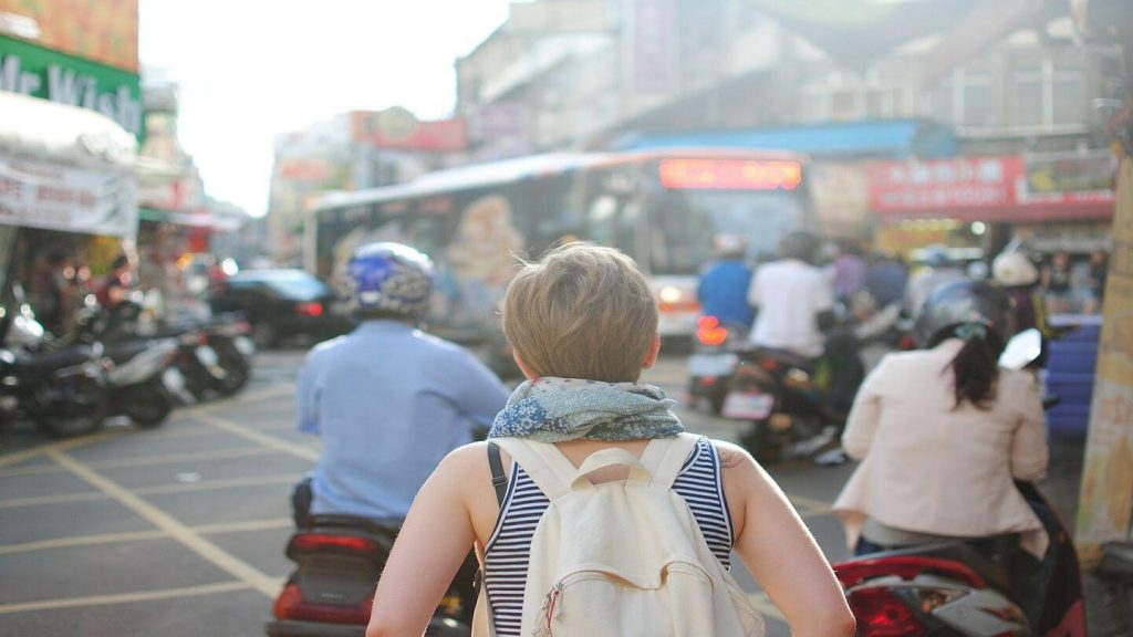 woman walking busy street