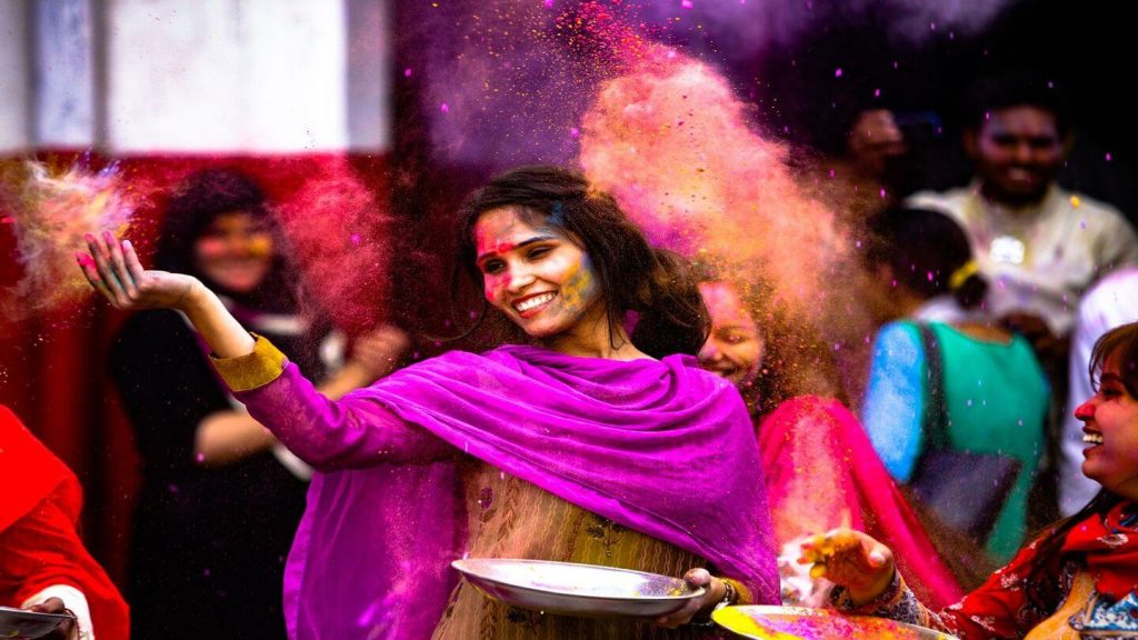 woman throwing powder holi celebrations india