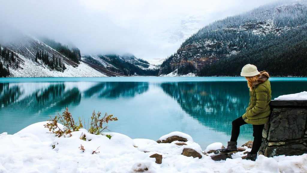 woman at snowy canada lake