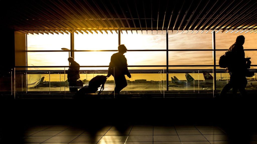 people walking through airport