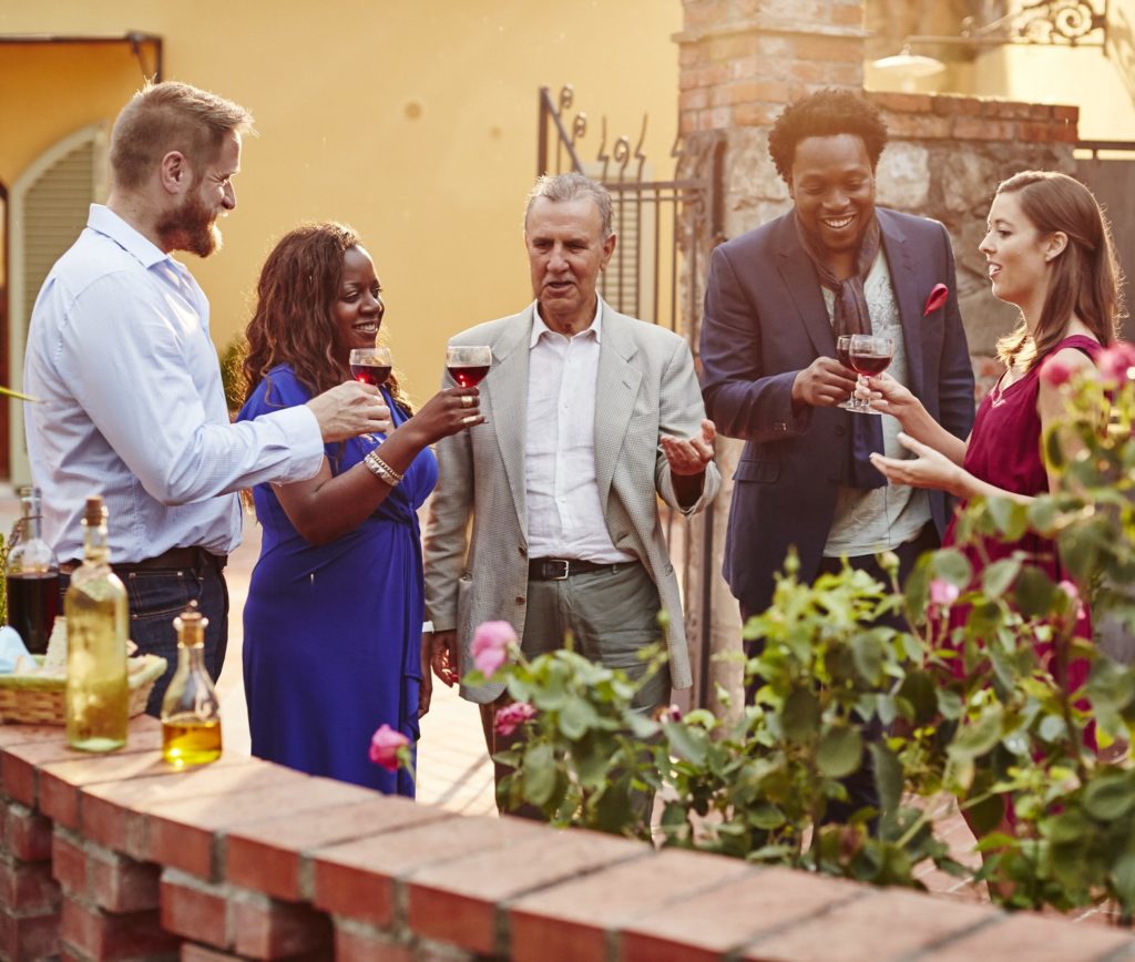 Enjoying wine outside in the sun with friends